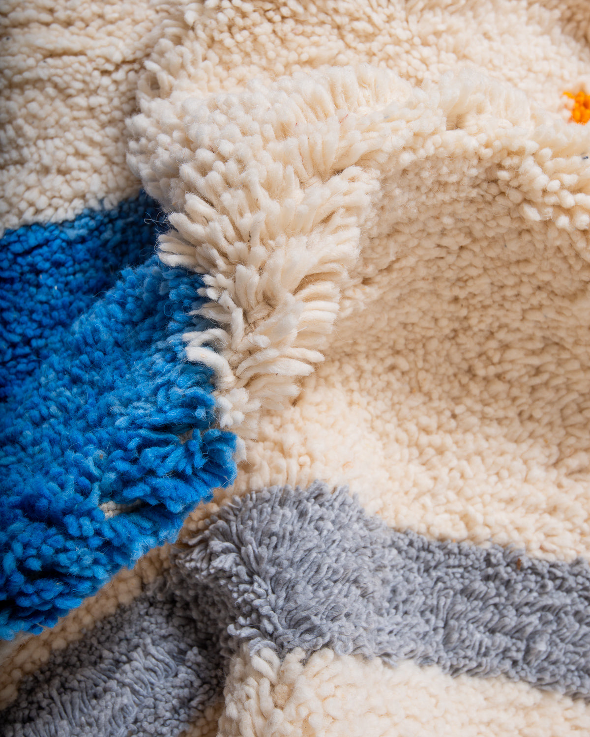 Modern, designer, handcrafted Berber rug from Morocco. Beniourain carpet with beautiful colours and patterns and fluffy wool texture.